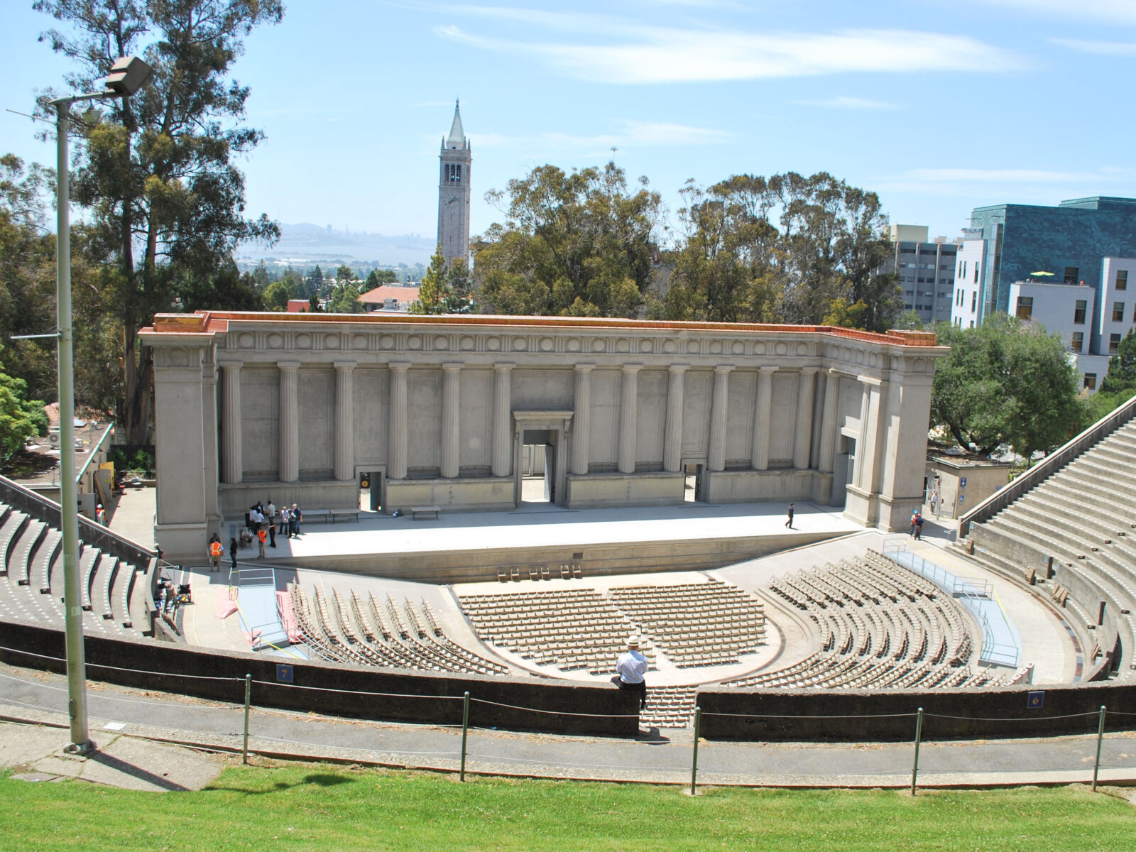 UC Berkeley's Hearst Greek Theatre, which looks like an amphitheater. The clock tower is visible in the background.
