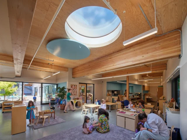 A place to learn and play, inside and out! At Children’s Day School Preschool (@cds.sf), a new wood framed preschool building replaces several portable classrooms on a tight urban site in San Francisco. 

Atop the 8,500 SF building, an occupied and planted roof deck serves as the preschool play yard. The roof structure is composed of exposed mass plywood panels, supported on glue laminate beams and columns with prefabricated light framed wood walls. The C-shaped building wraps around a mature elm tree that shades the preschool courtyard. A shallow mat foundation was carefully coordinated to both protect the existing tree and minimize foundation cost. Designed to limit embodied carbon, low cement concrete and mass timber super-structure were utilized.

Architect: @jensen_architects 
Contractor: @gcgbuilders 
Mass Timber Subcontractor: Gurnet Point 
Structural: Tipping (Leo Panian, Ian Kelso, David Ng, Henry Nistler)
Client: Children’s Day School
Photographer: @brucedamonte 

#tippingstructural #childrensdayschool #masstimber