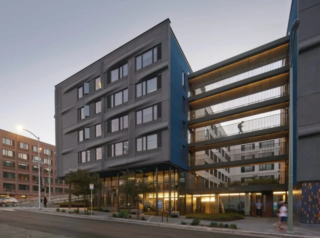 In response to the shortage of affordable #housing at @ucsf, the 375,000 SF, 6-story Tidelands Graduate Housing provides comfortable accommodations for 710 medical residents and trainees. This LEED Gold-certified complex was UCSF’s first #posttensioned building!

In response to strict neighborhood height requirements, the structural design team studied a variety of structural systems, including post-tensioned concrete, mild steel reinforced concrete, light gauge bearing walls, and a proprietary steel moment frame. Post-tensioned concrete was eventually selected to maximize the number of floors and the ceiling height, making this the first post-tensioned project on campus. In response to concerns from the campus about this structural system, the team developed a hybrid post-tensioned slab system with higher concrete cover to the tendons to provide extra protection against corrosion and increased flexibility for future work in the building, as well as more flexibility for seismic anchorage of building components, for quicker recovery after an earthquake.

https://tippingstructural.com/projects/ucsf-tidelands/

Owner: University of California, San Francisco
Architect: @kierantimberlake 
Contractor: @skanskausa 
Structural: Tipping
Photography: Bruce Damonte

#universityhousing #studenthousing #tippingstrucrual