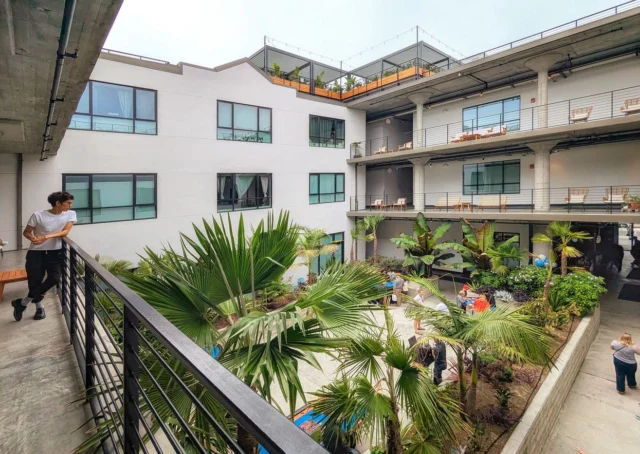 Step inside the Storehouse Lofts, an #adaptivereuse of a WWII-era military warehouse in the Naval Air Station Alameda Historic District. Transforming the 302,500 SF building into 200 #livework lofts, the project demonstrates how a creative, analysis-driven structural engineering approach can unlock the latent capacity of a historic building to deliver much-needed Bay Area housing.

Our team took advantage of detailed original design drawings to build a nonlinear response history analysis, leveraging the capacity of the existing three-story reinforced concrete structure to develop a surgical and cost-effective seismic retrofit.  Three central atria were introduced to bring natural light to living spaces, strategically positioned away from perimeter shear walls, where diaphragm forces would be low. A “green zone” coring strategy, developed through detailed finite-element slab modeling, identified non-critical reinforcing areas where regular utility penetrations could be made without slab strengthening, avoiding significant potential cost.

Architect: Wong Logan Architects 
Developer & Contractor: Alameda Point Redevelopers
Structural: Tipping (Marc Steyer, Isaac Williams)
Nat’l Historic Registry no. 12001191

📸: Wong Logan Architects (1-2), Maurice Ramirez (3-5)

#tippingstructural #historicpreservation #housing